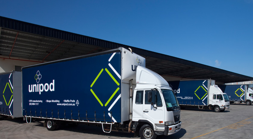 Unipod delivery trucks Unipod delivery trucks lined up outside a factory